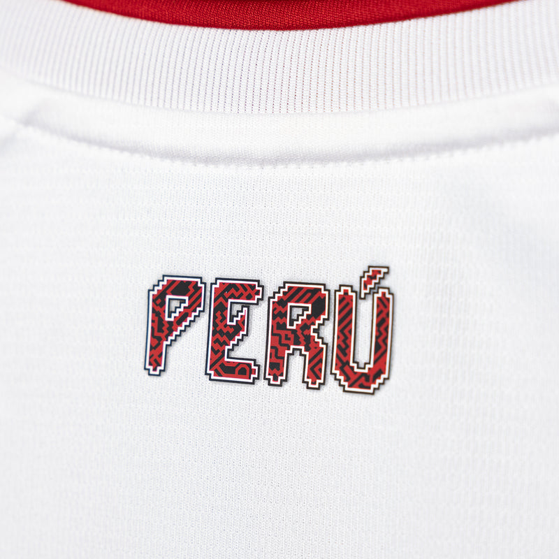 PERU lettering graphic on white soccer jersey chest with red-outlined letters
