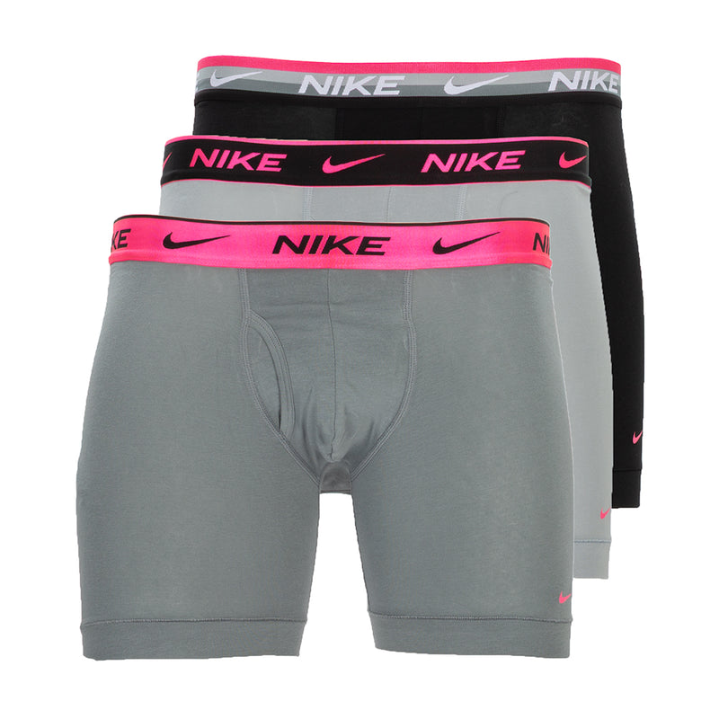 Three-pack Dri-FIT boxer briefs: grey, pink, and black with Nike logo waistbands.
