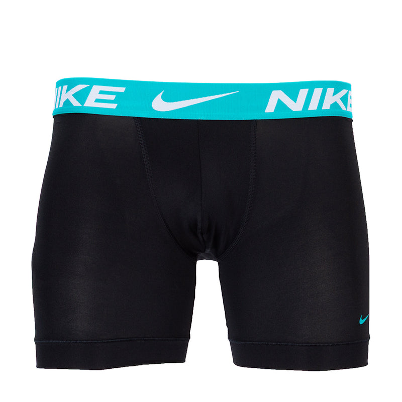 Black boxer briefs with teal waistband and NIKE logo print, mid-thigh length