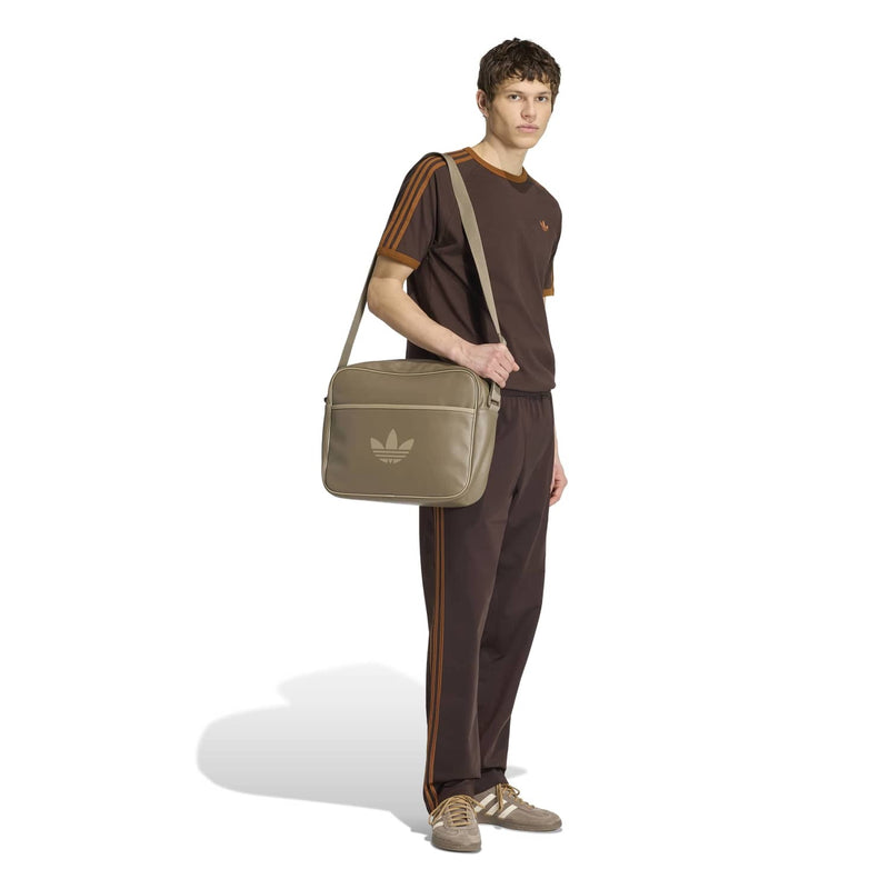Men's brown T-shirt with orange three-stripe shoulder and sleeve accents