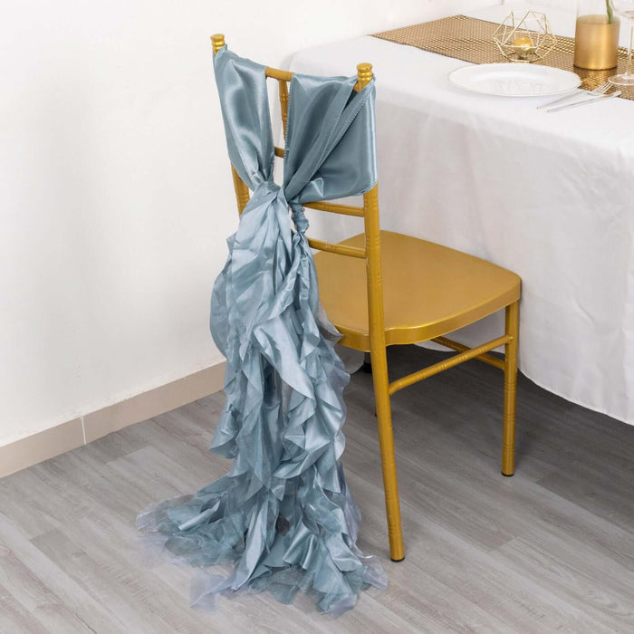 Blue ruffled chair sash draped on a gold chair at a dining table.