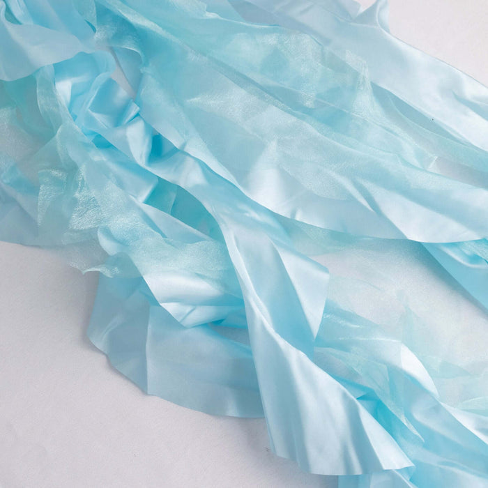Light blue satin ribbons in a flowing arrangement on a white background. #whtbkgd