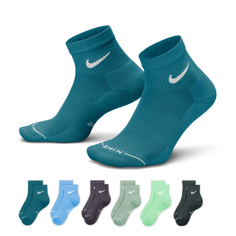 Pair of teal quarter crew socks with white Nike swoosh on ankle