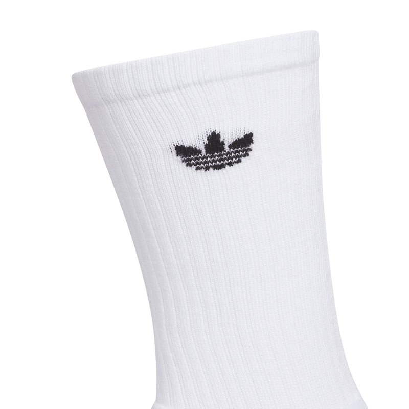 White crew sock with black trefoil-style logo on the cuff, ribbed knit