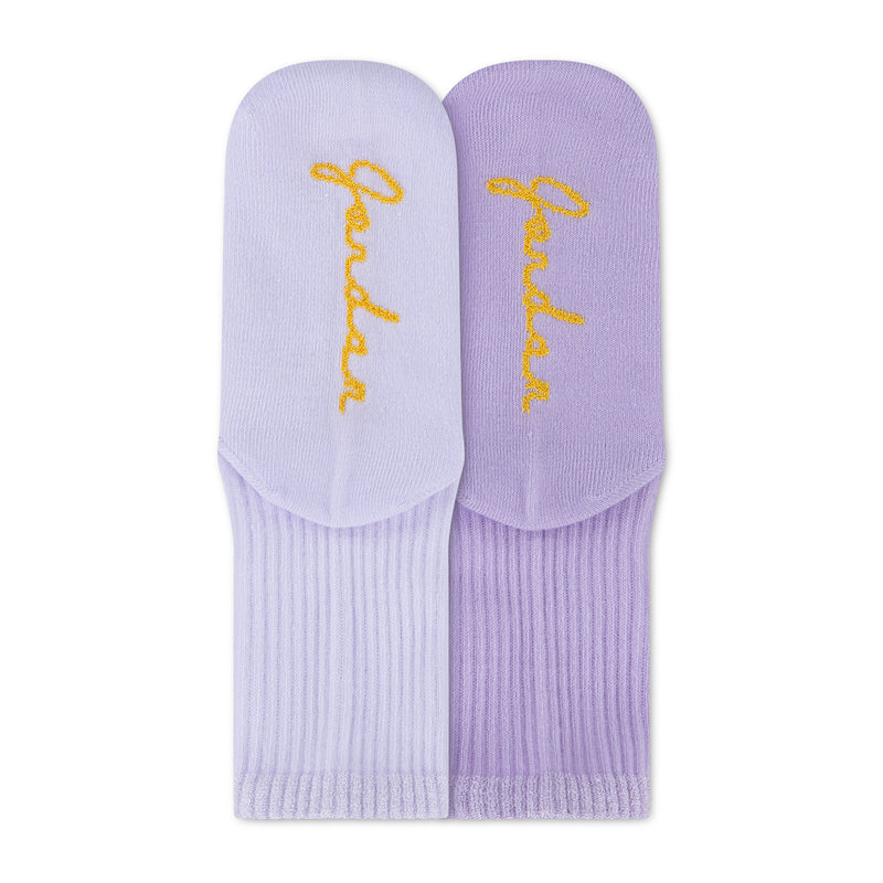 Air Jordan half crew socks close-up in light purple and lavender with yellow logo