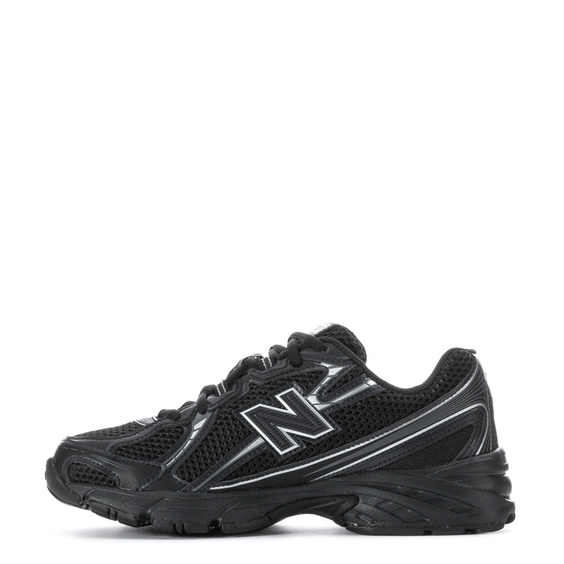 Youth black lace-up sneakers with bold silver N logo and textured midsole