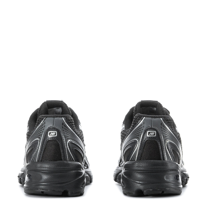 Youth black sneakers, rear view with padded collar and sculpted tread sole