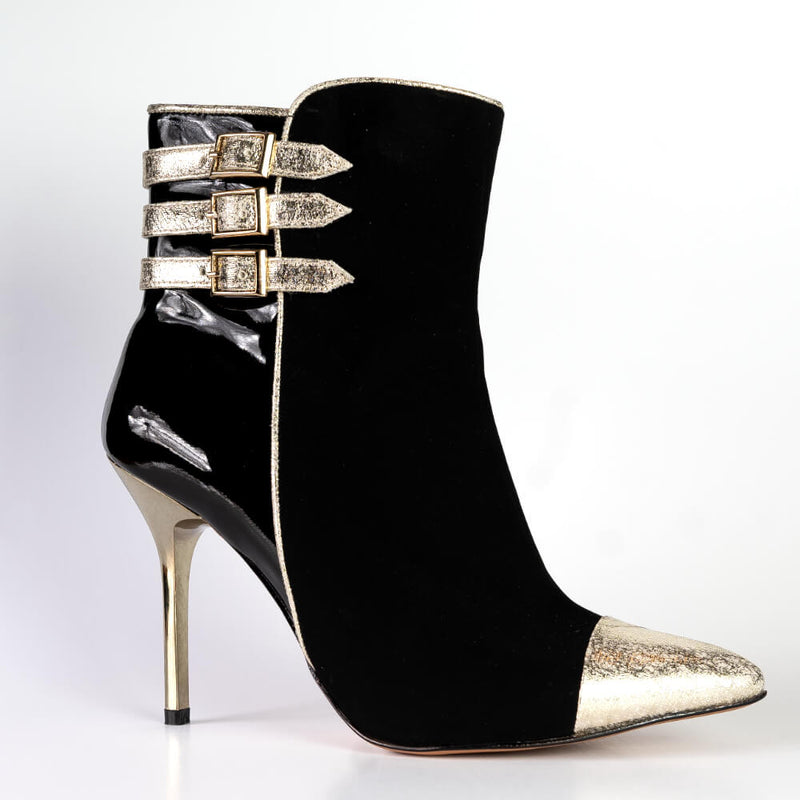 Stylish boots in black with gold accents perfect for work or a night out.