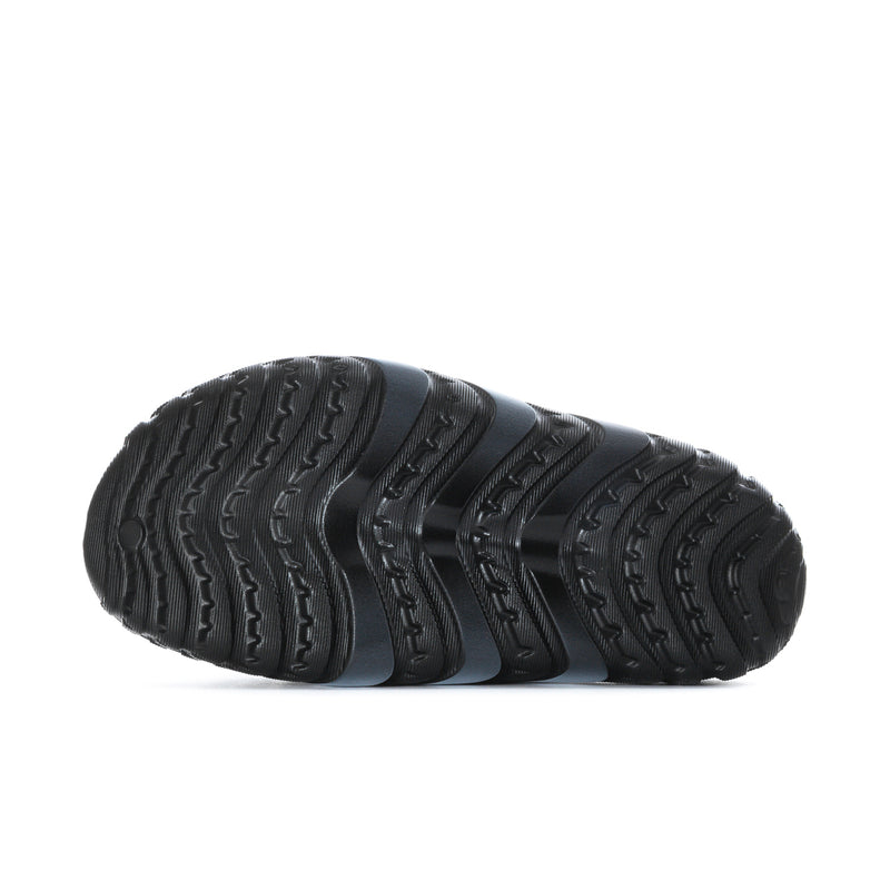Men's black slide sandal outsole with deep tread pattern and textured sidewall