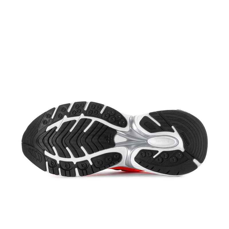 Men's running shoe outsole with black traction tread and silver-gray midsole