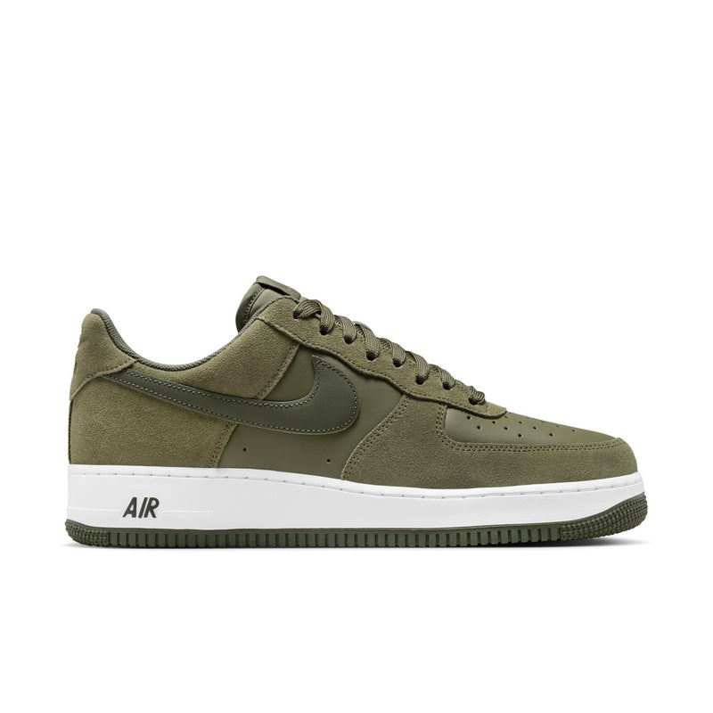 Men's low-top sneakers in olive suede with white midsole and lace-up front, Nike swoosh.