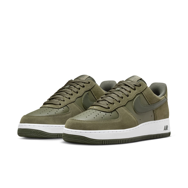 Pair of men's low-top sneakers in olive suede with white midsoles, lace-up front, Nike swoosh.