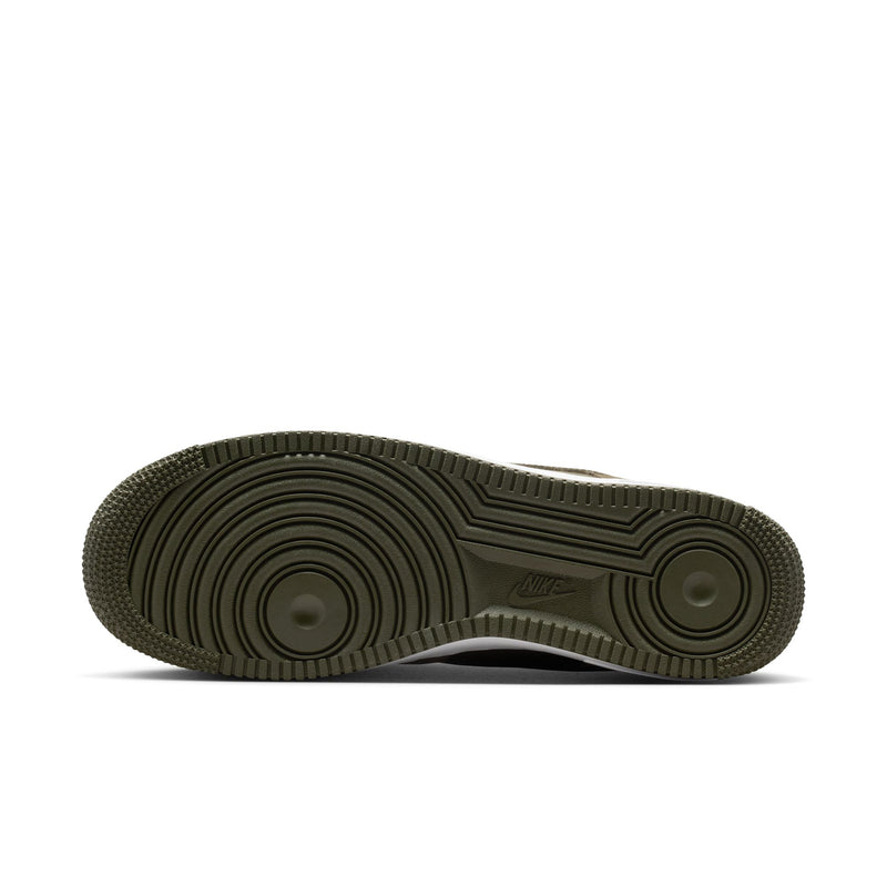 Men's low-top sneakers outsole with dark green rubber traction tread and white-edged base.