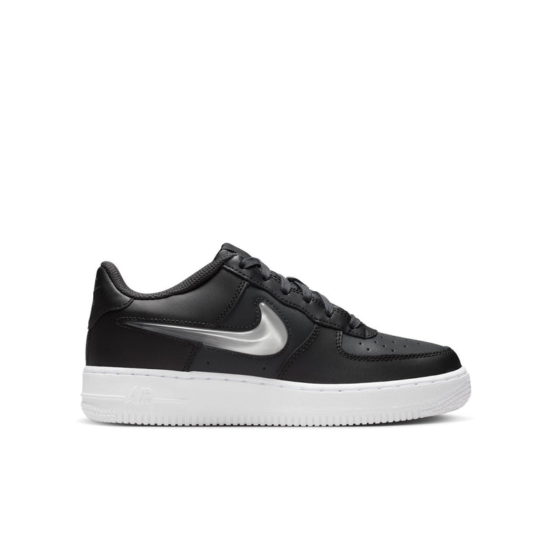 Youth low-top sneaker in dark leather with silver swoosh and white rubber sole
