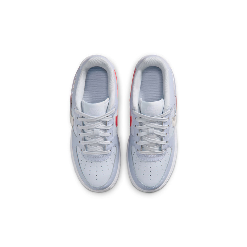 Pair of youth light blue-gray low-top sneakers with white laces and perforated toe