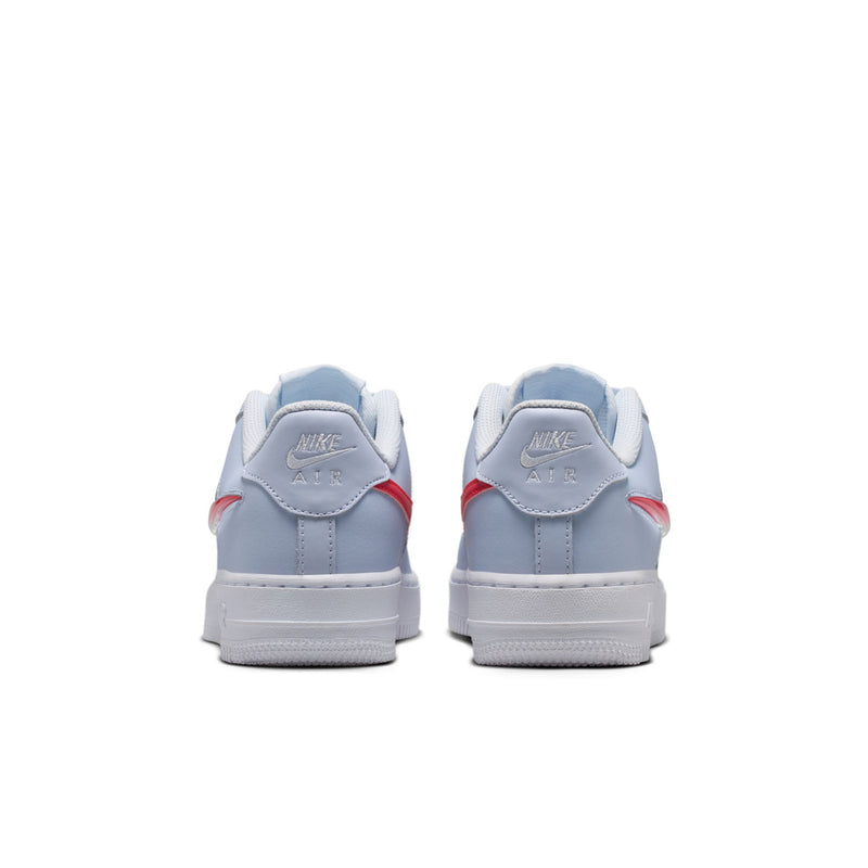 Youth low-top sneakers heel view in light blue-gray with red heel accents