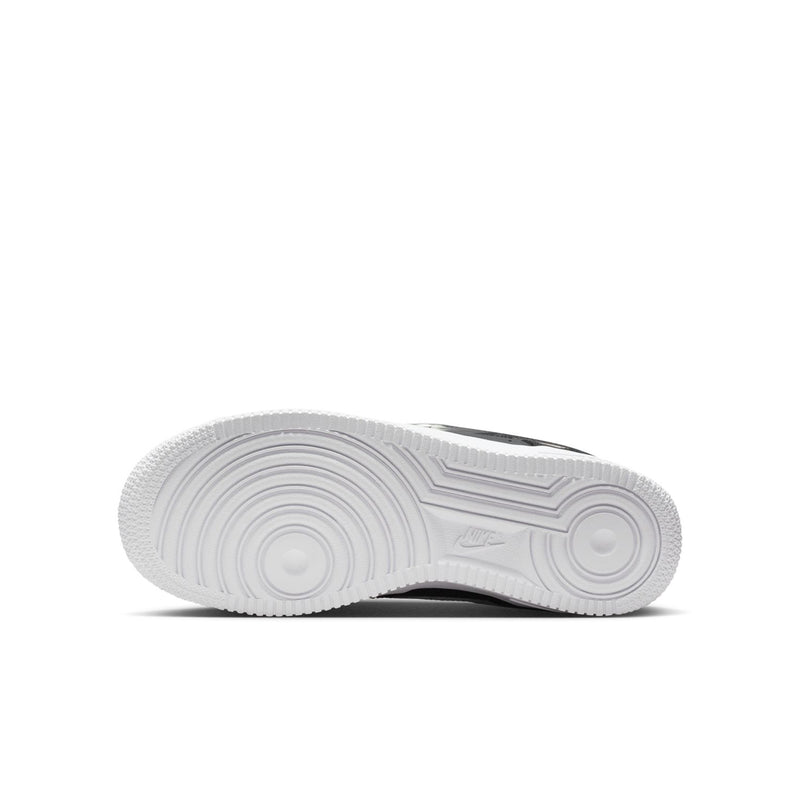 Youth low-top sneaker outsole with textured tread and white rubber bottom