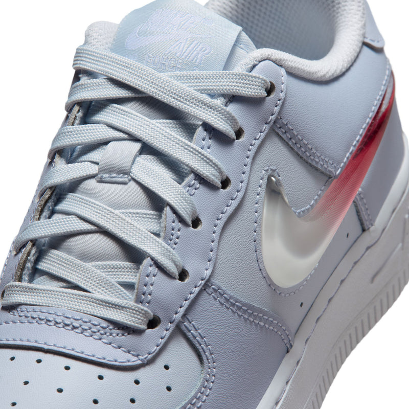 Close-up of youth light blue-gray sneaker laces with red-and-white Swoosh