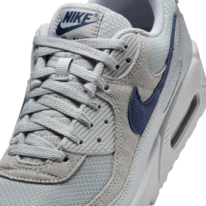 Air Max 90 men's sneaker close-up on laces and tongue with navy swoosh logo