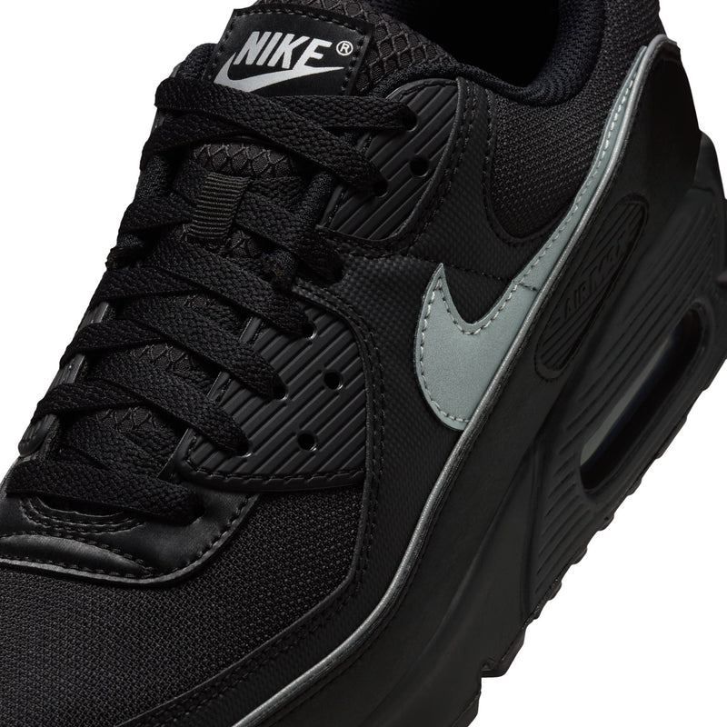 Close-up of men's Nike Air Max 90 upper, black laces with light blue swoosh detail