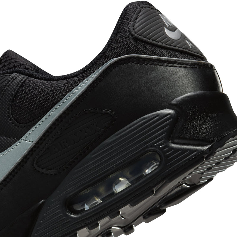 Close-up of Nike Air Max 90 side, black leather with air window and light blue trim