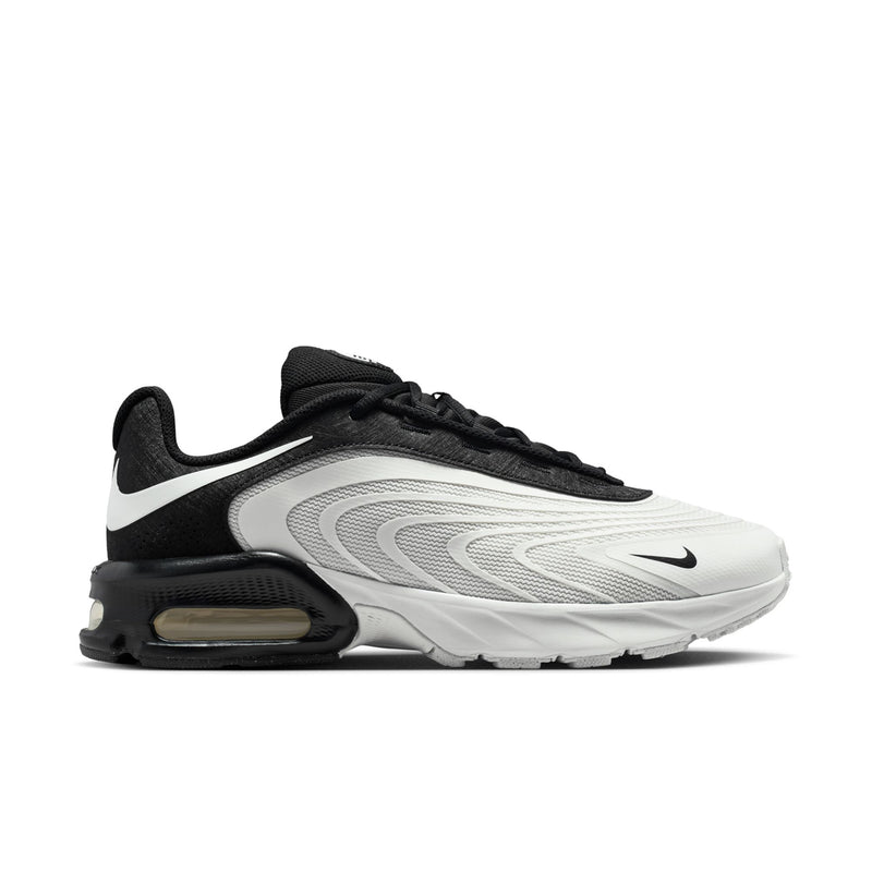 Men's running shoes, white and black with Swoosh and visible Air Max heel unit