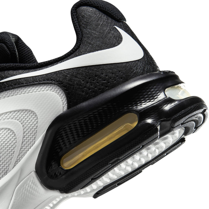 Close-up of heel Air Max unit with black housing and gold-tinted air window
