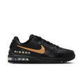 Men's black low-top sneakers with gold Swoosh and AIR MAX side text, visible air unit