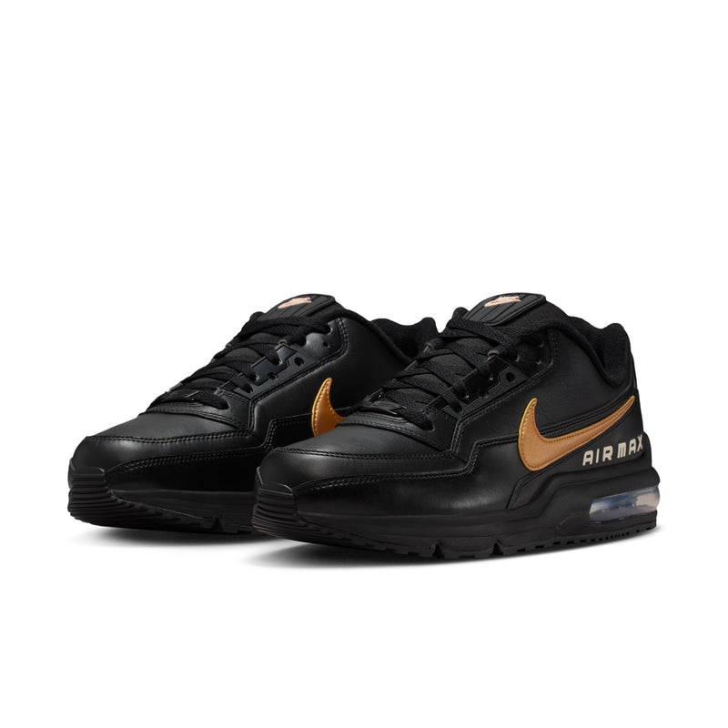 Pair of men's black low-top sneakers with gold Swoosh accents and AIR MAX branding