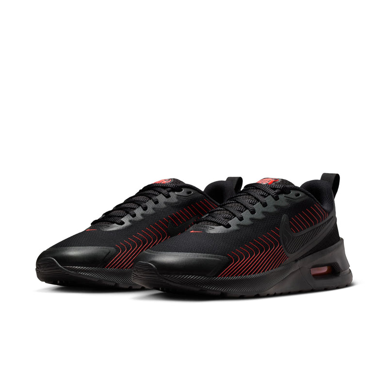 Men's black low-top sneakers with red pattern overlays and pink Air heel