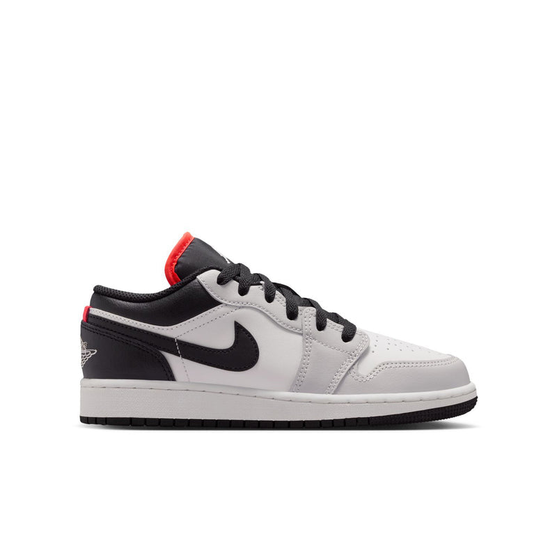Youth low-top sneakers, white and black with red heel accents and Nike swoosh