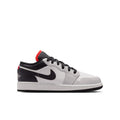 Youth low-top sneakers, white and black with red heel accents and Nike swoosh