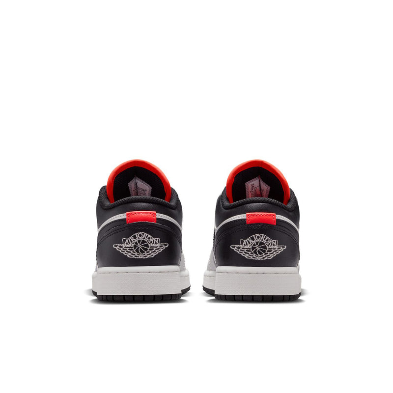 Youth sneakers heel view in black with red collar trim and Wings logo