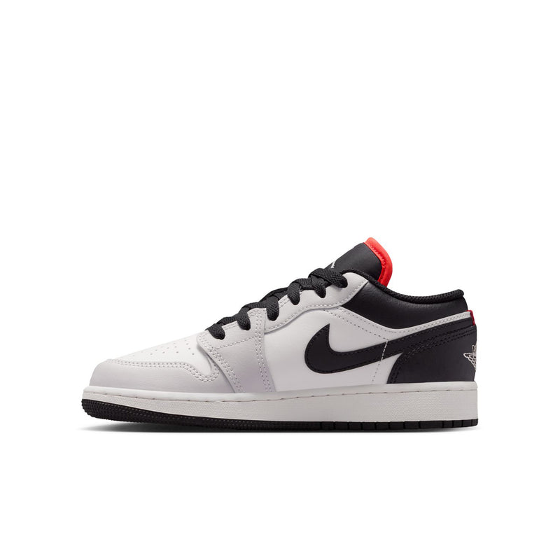 Youth low-top sneakers in white and black with red heel and Nike swoosh