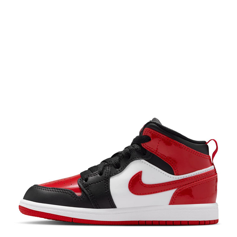 Kids mid-top sneakers with black laces, red upper, and white Nike Swoosh.