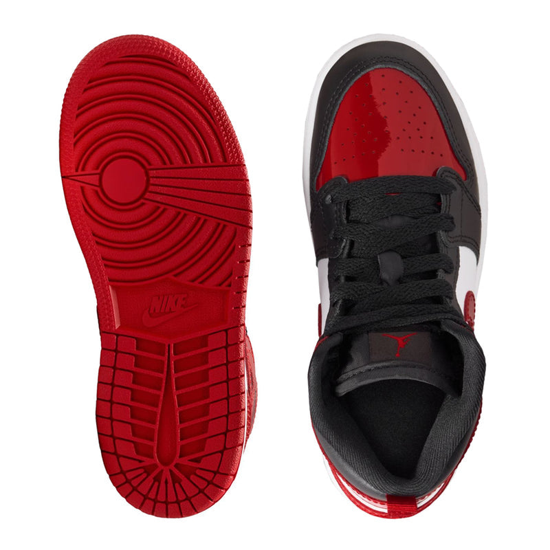 Kids mid-top sneaker soles: red outsole and black-and-red tread bottom view.