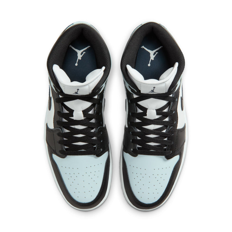 Black and light blue mid-top sneakers showing insoles with Air Jordan tongue logos