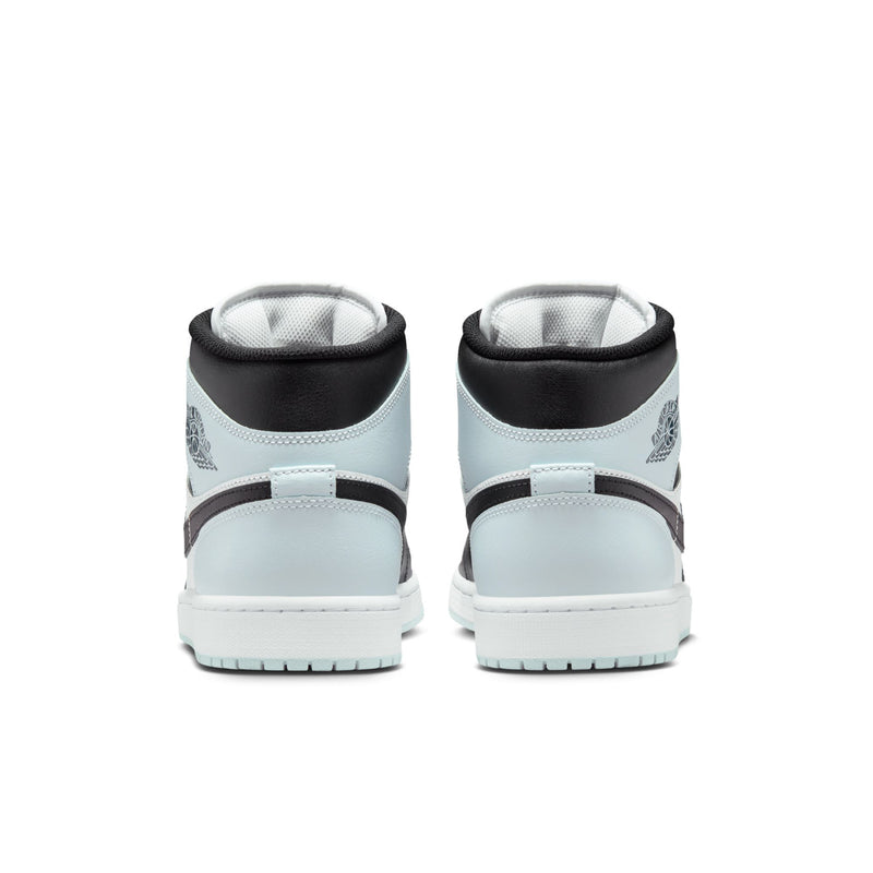 Back view of black and light blue mid-top sneakers with padded heel and white outsole