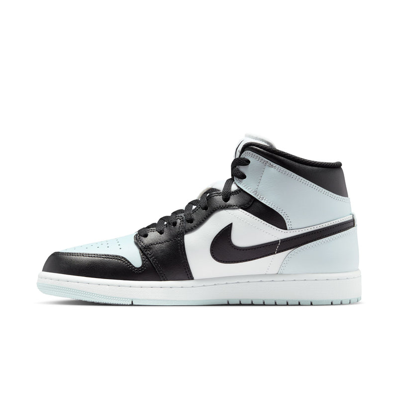 Side view of black, white, and light blue mid-top sneakers with lace-up and Swoosh
