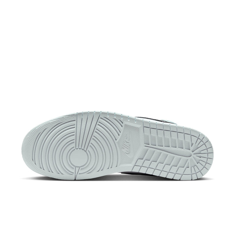Light blue outsole of mid-top sneakers with textured tread and circular logo