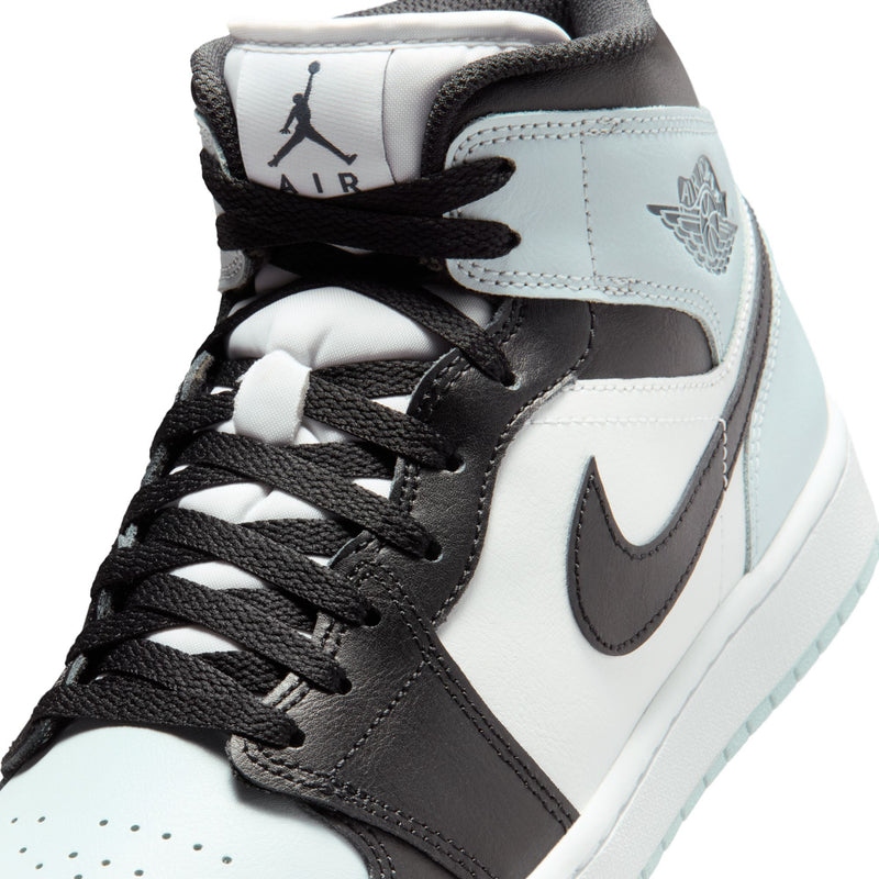 Close-up of black laces and light blue tongue on mid-top Air Jordan sneakers