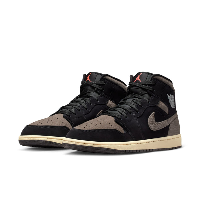 Pair of black and olive grey mid-top sneakers with laces, swooshes, and beige sole.