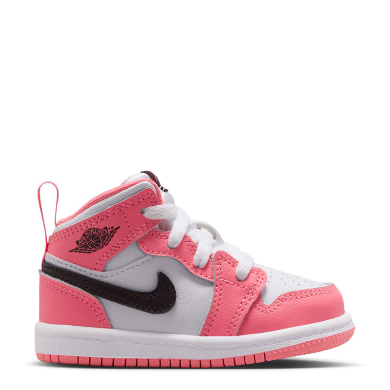 Pink, white, and black toddler mid-top sneakers with white laces and black Nike swoosh