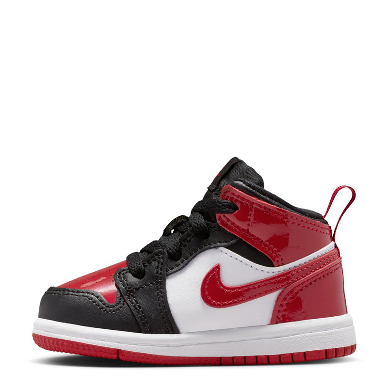 Toddler mid-top sneakers with black leather, red strap, white toe panel, red Swoosh