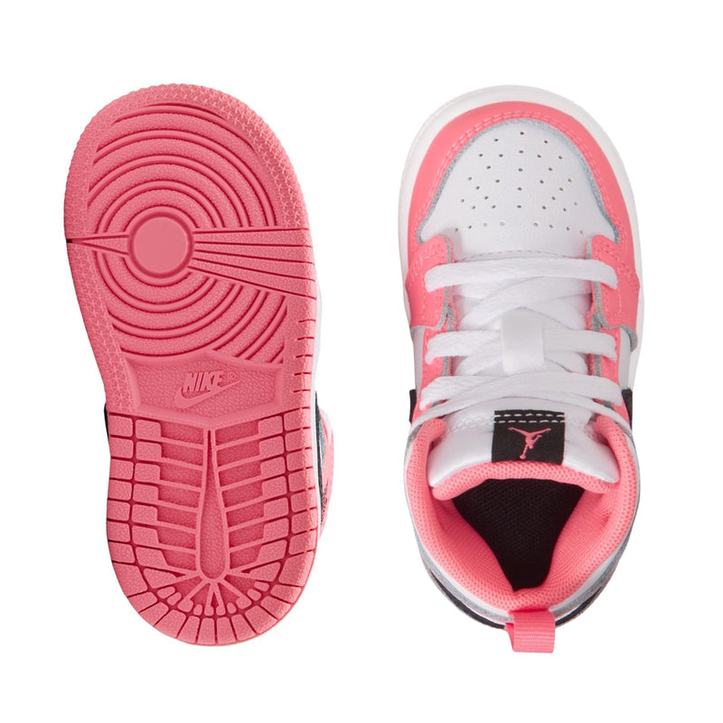 Toddler sneaker outsole and inside view: pink tread bottom and pink-trimmed white upper