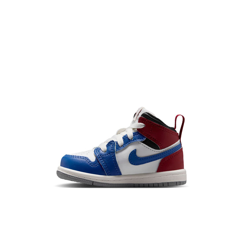 Kids' mid-top sneakers side view with white toe, blue overlays, and red ankle panel