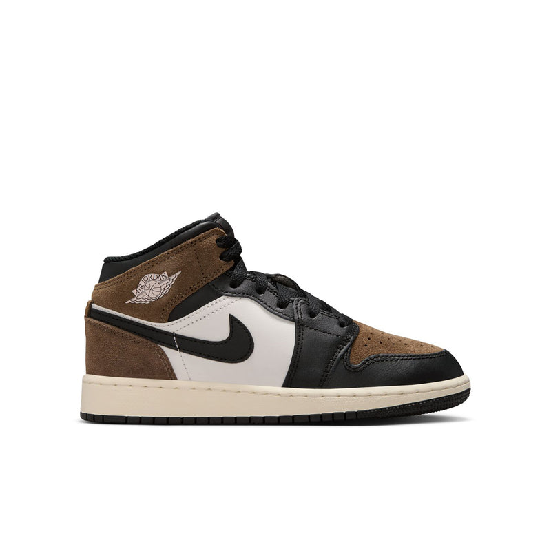 Youth mid-top sneakers with brown suede panels, black laces, white side, black swoosh.