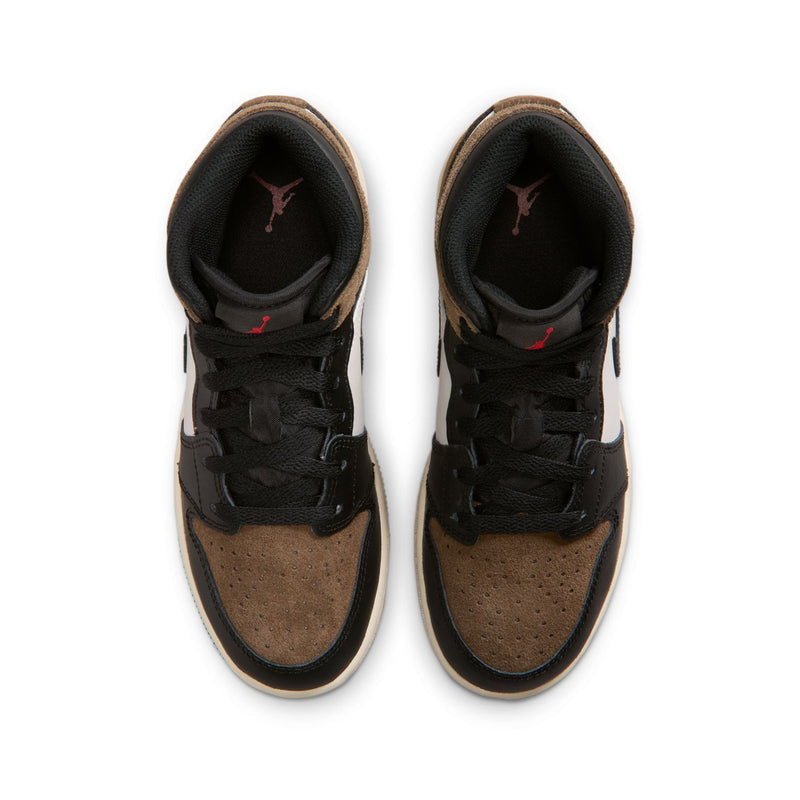 Youth sneakers showing black interior, brown suede uppers, and black lace-up closure.