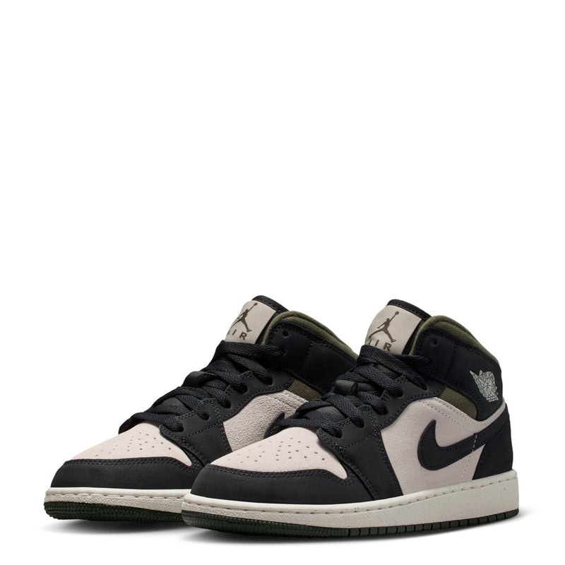 Youth mid-top sneakers pair, off-white toe panels with black Swoosh and olive collar