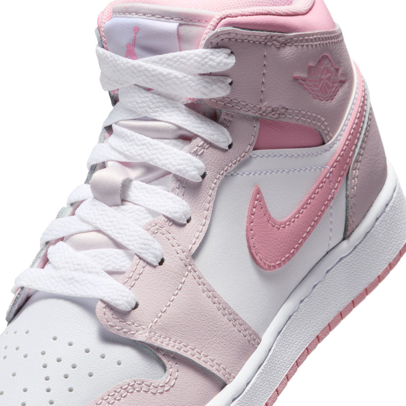 Close-up of youth high-top sneaker upper with pink Swoosh, stitching, and laces